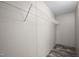 A walk-in closet with woodgrain flooring features white metal shelving at 130 Ruby Trl, Roxboro, NC 27574