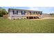 Charming single-Gathering home with a front porch and a spacious green lawn at 130 Ruby Trl, Roxboro, NC 27574
