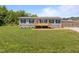 Charming home featuring a welcoming front porch and well-maintained lawn at 130 Ruby Trl, Roxboro, NC 27574