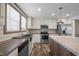 This kitchen features butcher block countertops, stainless steel appliances, and a farmhouse sink beneath a window at 130 Ruby Trl, Roxboro, NC 27574