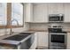 This kitchen features woodgrain countertops, stainless steel appliances, and a stainless steel farmhouse sink at 130 Ruby Trl, Roxboro, NC 27574