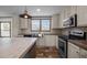 This kitchen features woodgrain countertops, stainless steel appliances, and a stainless steel farmhouse sink beneath a window at 130 Ruby Trl, Roxboro, NC 27574