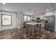 Modern kitchen featuring a central island, stainless steel appliances, and ample cabinetry at 130 Ruby Trl, Roxboro, NC 27574
