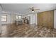 Open-concept living space with a modern kitchen and wood-look floors at 130 Ruby Trl, Roxboro, NC 27574
