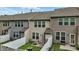 Backyard view with privacy fences, a small patio with chairs, and green space for relaxing or entertaining at 136 Thornhill Dr, Burlington, NC 27215