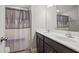 Bathroom with double vanity and shower/tub combo, providing functionality and comfort with neutral tones at 136 Thornhill Dr, Burlington, NC 27215