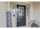 Inviting front entry featuring a black front door with glass and charming decorations at 136 Thornhill Dr, Burlington, NC 27215