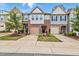 Charming townhome with well-maintained landscaping, brick accents, and inviting curb appeal at 136 Thornhill Dr, Burlington, NC 27215