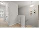 Upstairs hallway with neutral paint leads to bedrooms and baths, showcasing a bright and airy atmosphere at 136 Thornhill Dr, Burlington, NC 27215