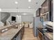 Modern kitchen with granite countertops, stainless steel appliances, and dark wood cabinets at 136 Thornhill Dr, Burlington, NC 27215