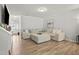 Comfortable living room with hardwood floors, plush sectional sofa, and stylish decor at 136 Thornhill Dr, Burlington, NC 27215