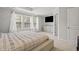 Bright main bedroom with ample natural light features a large window and walk-in closet, offering comfort and convenience at 136 Thornhill Dr, Burlington, NC 27215