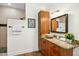 Bright bathroom features granite countertops, wood cabinetry, and a walk-in shower at 139 Trillium Pl, Chapel Hill, NC 27517