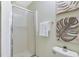 Bright bathroom with a glass-enclosed shower, towel rack, and neutral-toned wall art at 139 Trillium Pl, Chapel Hill, NC 27517