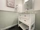 Bathroom features a white vanity, modern mirror, and neutral-toned paint at 139 Trillium Pl, Chapel Hill, NC 27517