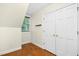 Cozy bedroom featuring wood floors, a large closet, and a window at 139 Trillium Pl, Chapel Hill, NC 27517