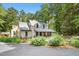 Inviting two-story home with a covered porch and well-manicured garden, blending comfort and natural beauty at 139 Trillium Pl, Chapel Hill, NC 27517