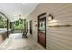 Cozy front porch with rocking chairs, ceiling fan, and stylish decor offering a relaxing outdoor space at 139 Trillium Pl, Chapel Hill, NC 27517
