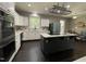 Bright kitchen boasts stainless appliances, island cooktop, and ample cabinet space at 139 Trillium Pl, Chapel Hill, NC 27517