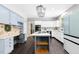 Spacious kitchen features sleek appliances, an island, and eat-in breakfast nook at 139 Trillium Pl, Chapel Hill, NC 27517