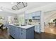 Kitchen featuring blue center island, white countertops, and built-in desk area at 139 Trillium Pl, Chapel Hill, NC 27517