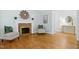 Bright living room featuring hardwood floors, fireplace, and stylish decor offering a comfortable living space at 139 Trillium Pl, Chapel Hill, NC 27517