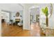 Elegant living room showcasing hardwood floors, fireplace, and archway leading to other living spaces at 139 Trillium Pl, Chapel Hill, NC 27517
