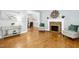 Spacious living area with hardwood floors, fireplace, and open layout into the dining room, perfect for entertaining at 139 Trillium Pl, Chapel Hill, NC 27517