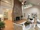 Grand living room showcasing a fireplace and lofty vaulted ceilings at 139 Trillium Pl, Chapel Hill, NC 27517