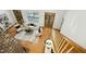 Inviting living room featuring wood floors, a fireplace, and access to an outdoor deck at 139 Trillium Pl, Chapel Hill, NC 27517