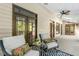 Inviting screened porch with ceiling fan and outdoor seating at 139 Trillium Pl, Chapel Hill, NC 27517