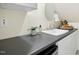 Convenient wet bar area with a countertop, sink, and cabinetry at 139 Trillium Pl, Chapel Hill, NC 27517
