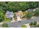 Aerial view of a residential neighborhood featuring well-maintained homes and tree-lined streets at 1406 Pebble Creek Xing, Durham, NC 27713