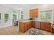 Well-lit kitchen with stainless steel appliances, light wood cabinets, and a dining area at 1406 Pebble Creek Xing, Durham, NC 27713