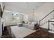 Inviting living room showcasing vaulted ceilings, a cozy sofa, and a staircase at 1406 Pebble Creek Xing, Durham, NC 27713