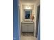 Compact bathroom featuring granite countertops, ample storage, a well-lit mirror, and tasteful decor at 146 Verona Villa Dr, Burlington, NC 27215