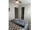 Neutral bedroom featuring a ceiling fan, carpet floors and an open doorway to the bathroom at 146 Verona Villa Dr, Burlington, NC 27215