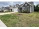 Charming home featuring stone accents, well-maintained landscaping, and an attached two-car garage at 146 Verona Villa Dr, Burlington, NC 27215