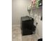 Laundry room features a new washer and dryer and overhead storage at 146 Verona Villa Dr, Burlington, NC 27215