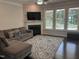 Inviting living room showcases hardwood floors, a cozy fireplace, and large windows for natural light at 146 Verona Villa Dr, Burlington, NC 27215