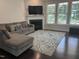 Inviting living room with a fireplace, plush sofa, and abundant natural light at 146 Verona Villa Dr, Burlington, NC 27215