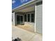 Covered patio with sliding glass door and ample space for outdoor enjoyment at 146 Verona Villa Dr, Burlington, NC 27215