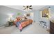 Comfortable bedroom with vibrant bedding, carpet, and plenty of space at 1634 Claiborne Ct, Raleigh, NC 27606