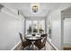 Cozy dining area with a skylight, wood flooring, and a view of the outside at 1634 Claiborne Ct, Raleigh, NC 27606