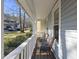 Inviting front porch with seating area perfect for relaxing outdoors and enjoying the neighborhood at 1634 Claiborne Ct, Raleigh, NC 27606