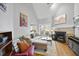 Cozy living room with high ceilings, fireplace, and stylish furnishings perfect for relaxation at 1634 Claiborne Ct, Raleigh, NC 27606