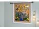 Stained glass window with mountain, sun, and waterfall design at 1634 Claiborne Ct, Raleigh, NC 27606
