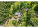 Aerial view of home with long drive way and mature trees surrounding the property at 1846 Hammond St, Rocky Mount, NC 27803