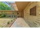 Inviting stone home entrance with a covered walkway, tiled entry and garden at 1846 Hammond St, Rocky Mount, NC 27803