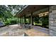 Stylish exterior with large windows offering views of the lush surroundings from the covered patio at 1846 Hammond St, Rocky Mount, NC 27803